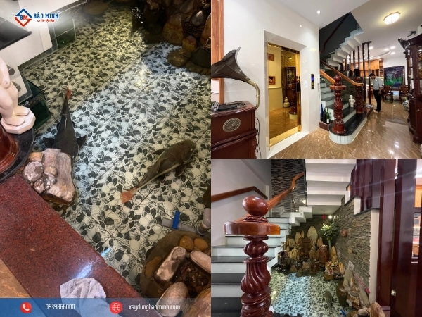 Một hồ cá trong nhà đjăt cạnh cầu thang